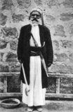 The Alawis, also known as Alawites, Nusayris and Ansaris, are a prominent mystical and syncretic religious group centred in Syria who constitute a branch of Shia Islam. Distinct Alawi beliefs include the belief that prayers are not necessary, they do not fast, perform pilgrimage, nor have specific places of worship. Traditionally Alawis live in the An-Nusayriyah Mountains along the Mediterranean coast of Syria. Latakia and Tartous are the region's principal cities. Alawis are also concentrated in the plains around Hama and Homs.<br/><br/>

Today Alawis also live in all major cities of Syria. They are estimated to constitute slightly less than 10% of the Syrian population (which would be about 2 million people in 2010).
