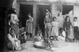 An Armenian-American sponsored refugee camp in Aleppo, Syria, c. 1922.  The original image was a postcard used to raise funds for the camp. Assisted by missionaries, these refugees, mostly women and children from the vicinity of Kharpert, Historic Armenia, made needlework to sell, the proceeds from which helped to support them and purchase passage to the United States.